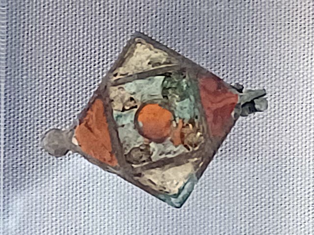 A copper alloy enamelled seal-box found at a previous dig