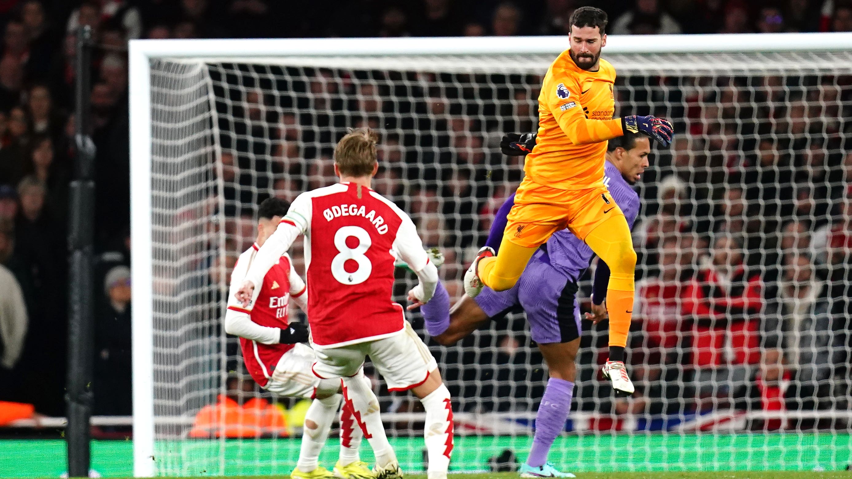 Gabriel Martinelli (left) scores Arsenal’s second goal after a mistake on Liverpool goalkeeper Alisson Becker (John Walton/PA)
