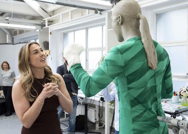 Mary Earps looking at her wax figure