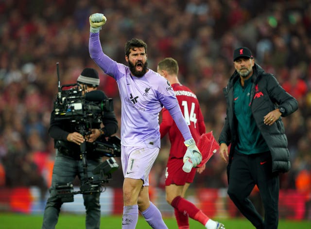 Alisson Becker celebrates 