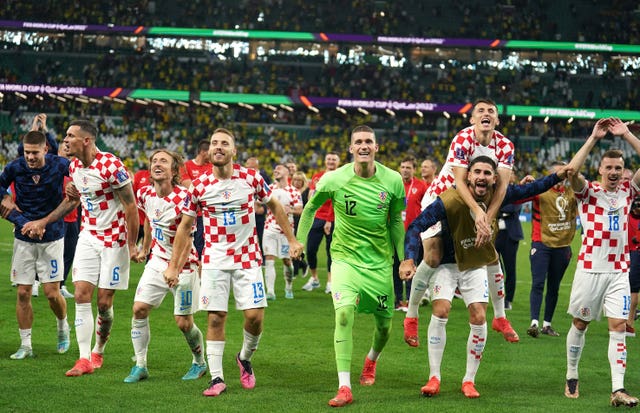 Croatia players celebrate after beating Brazil on penalties (Mike Egerton/PA).