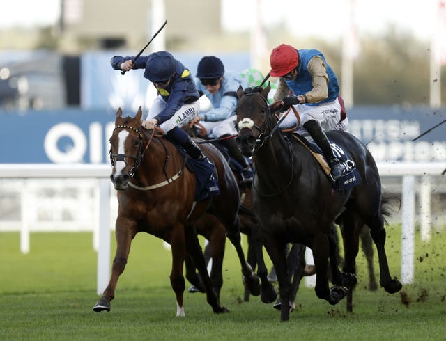 Kind Of Blue (red hat) won at Ascot on Champions Day