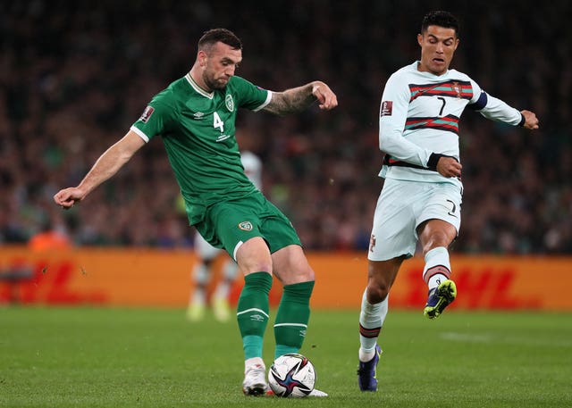 Republic of Ireland defender Shane Duffy (left) clears the ball under pressure from Portugal’s Cristiano Ronaldo
