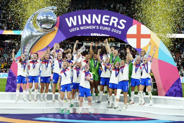 England’s Leah Williamson and Keira Walsh lift the trophy as they celebrate with team-mates after winning the UEFA Women’s Euro 2025 final at St. Jakob-Park in Basel, Switzerland. 