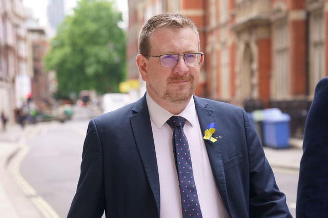 Andrew Gwynne walks along a street