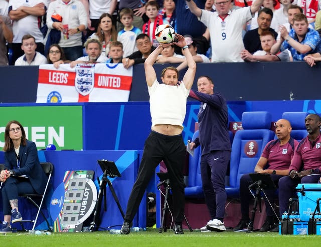England manager Gareth Southgate catches a high ball on the touchline during the Euro 2024 last-16 match against Slovakia