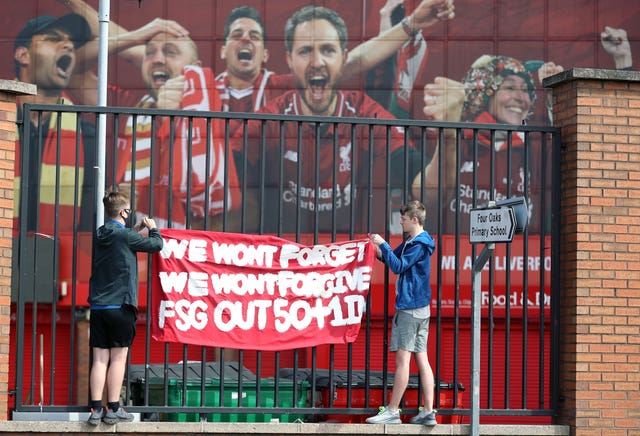 Liverpool fans protest against the clubs owners outside Anfield before kick-off