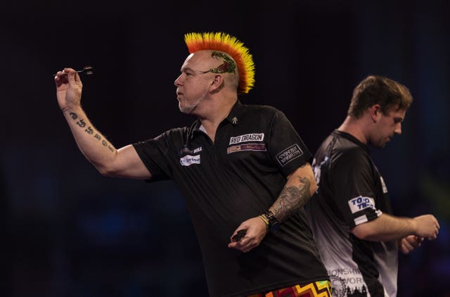 Peter Wright (left) and Callan Rydz in action at the William Hill PDC World Darts Championship
