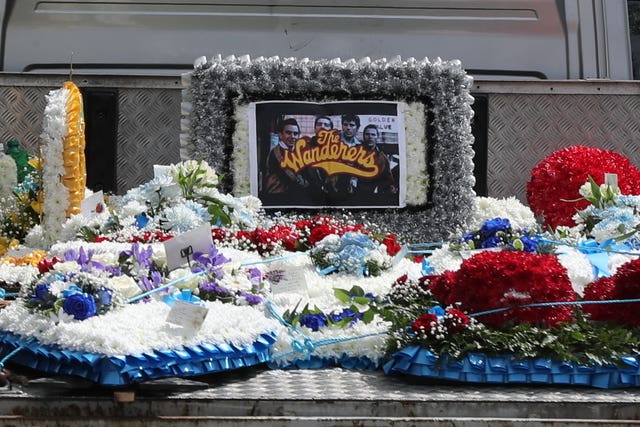 Flowers are displayed on the back of a vehicle that forms part of the funeral cortege of burglar Henry Vincent (Gareth Fuller/PA)