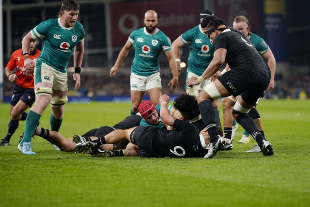 Ireland’s Josh van der Flier, centre, on ground, scores a try against New Zealand