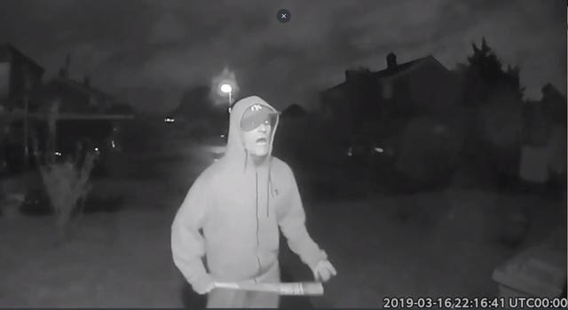 CCTV showing Vincent Fuller swinging a baseball bat outside a neighbour's house in Stanwell 