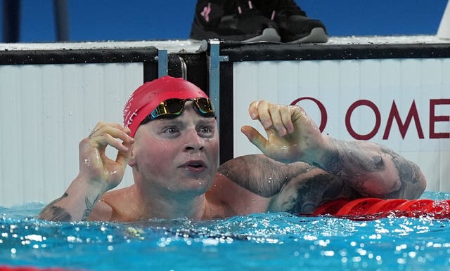Adam Peaty reacts after his swim