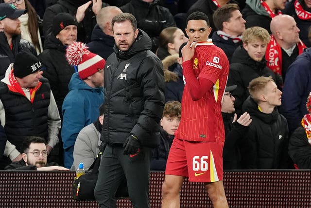 Liverpool’s Trent Alexander-Arnold, right, goes off injured against Paris St Germain