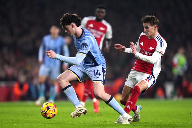 Tottenham's Archie Gray (left) and Arsenal’s Martin Odegaard battle for the ball