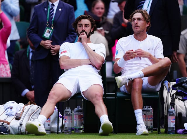 Max Purcell and Jordan Thompson looks devastated as they sit in their chairs after the match