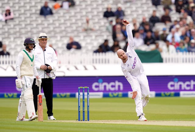 Jack Leach, right, bowls