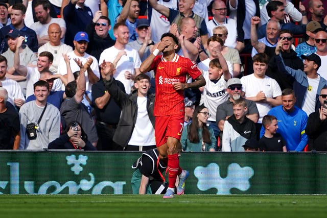 Liverpool forward Luis Diaz covers his eyes with his hand