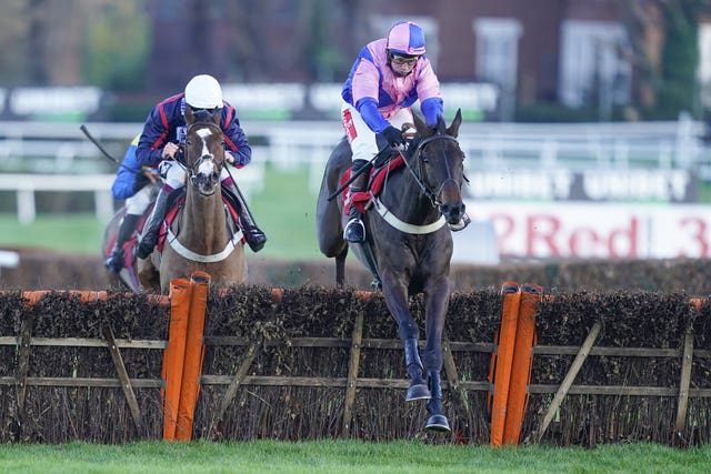 Hudson de Grugy ridden by Jamie Moore, right, clears the last to win The Unibet Extra Place Races Every Day Juvenile Hurdle at Sandown Park