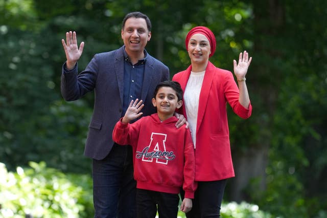 Anas Sarwar, his wife and son waving