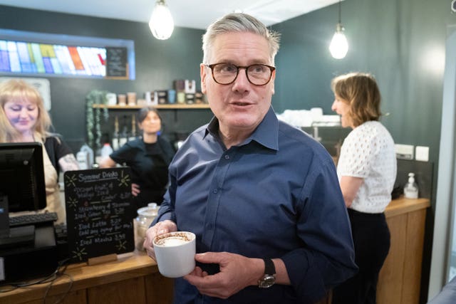 Labour Party leader Sir Keir Starmer meets pensioners during a visit to the Bridge Cafe in Bolton 