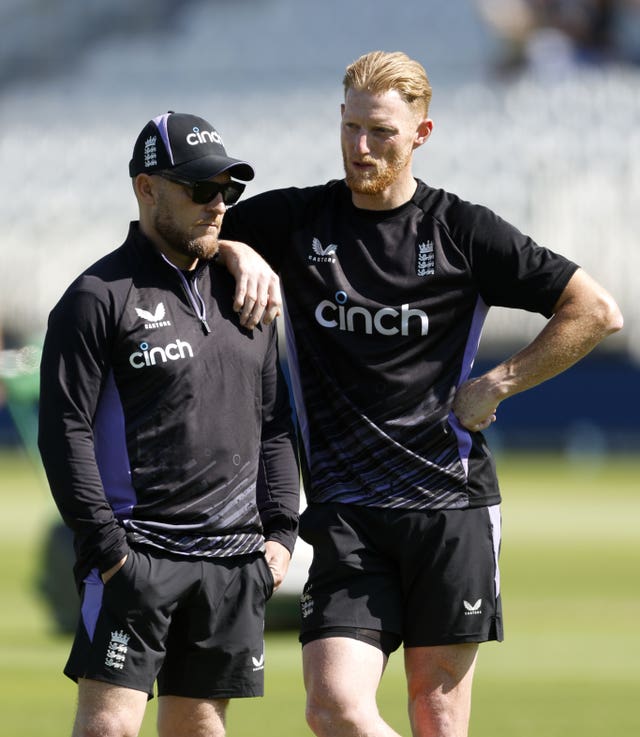 England captain Ben Stokes (right) leans on head coach Brendon McCullum (left) at a net session.