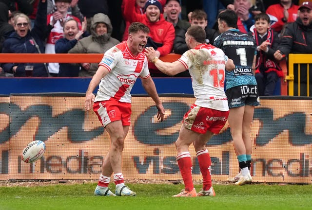 Tom Davies (left) celebrates his late try
