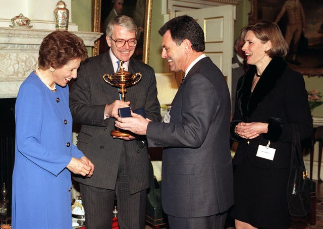 The 1995 Team Europe captain Bernard Gallacher shows Prime Minister John Major the Ryder Cup trophy after overcoming a deficit entering the singles to win for the first time in New York
