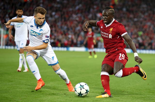 Hoffenheim’s Dennis Geiger, left, challenges Liverpool’s Sadio Mane 
