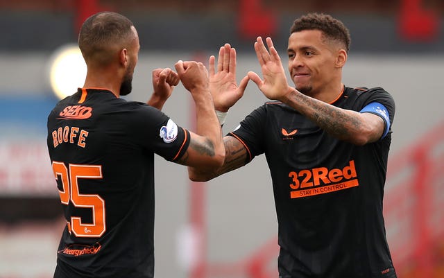 James Tavernier, right, celebrates a goal with Kemar Roofe