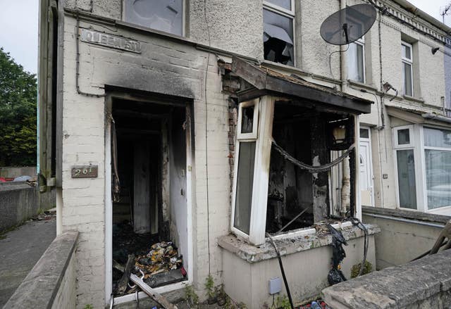 A burnt-out house on Queen Street following a second night of violence in Ballymena
