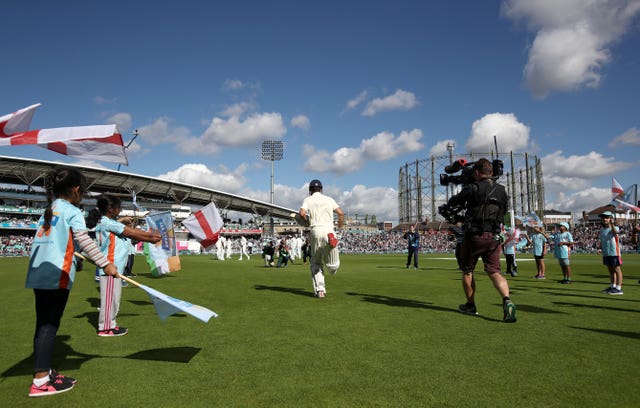 Cook received a guard of honour as he made his way to the crease