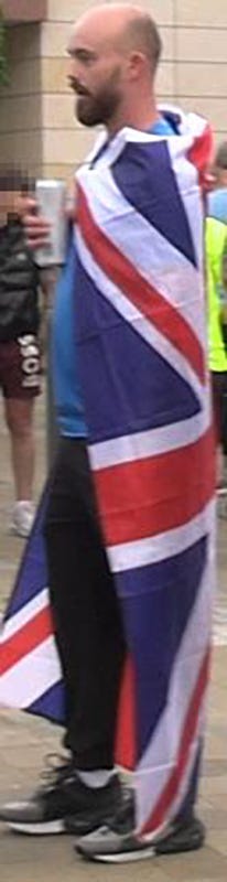 Kieran Usher, draped in a Union flag, during the violence in Sunderland on August 2