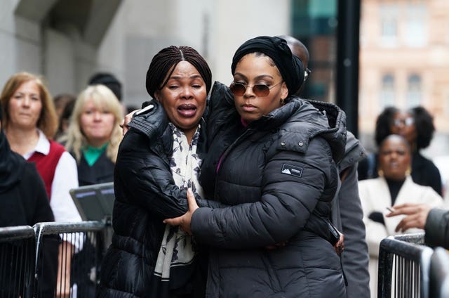 Helen Lumuanganu (left), the mother of Chris Kaba, arriving at the Old Bailey