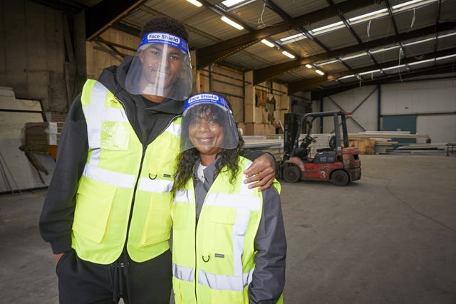 Marcus Rashford visiting FareShare Greater Manchester at New Smithfield Market with his mother Melanie (right)