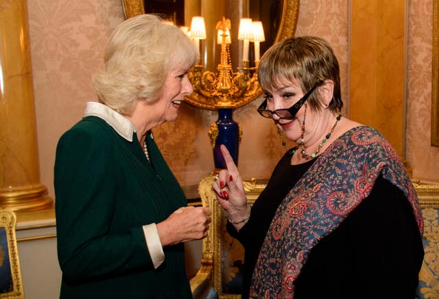 The then-Duchess of Cornwall shares a word with Dame Jenni at a reception at Buckingham Palace in 2016