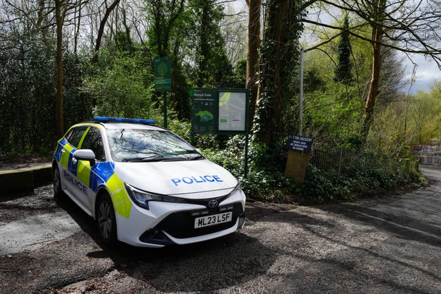 A police car parked at the entrance to Kersal Dale, near Salford, Greater Manchester 