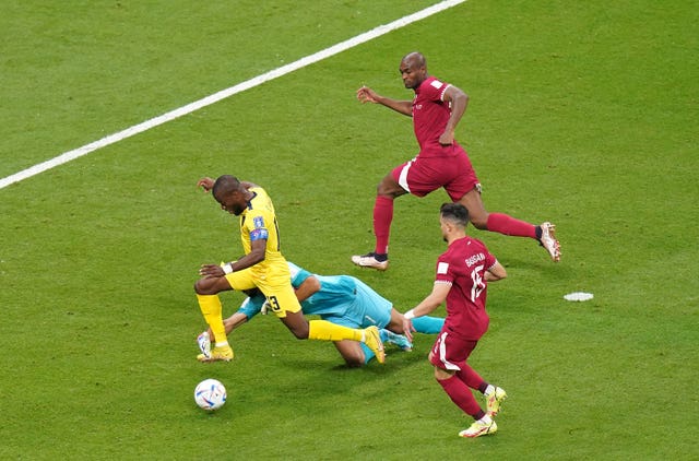Enner Valencia is brought down in the box by Qatar goalkeeper Saad Al Sheeb