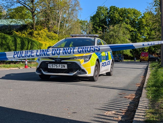 Police officers patrol at a cordon near to an incident at the Kenton United Synagogue in Harrow