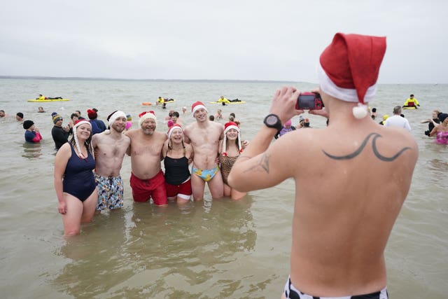 Swimmers pose for a photo during the Gosport New Year’s Day Dip