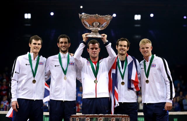 Great Britain captain Leon Smith lifts the Davis Cup trophy