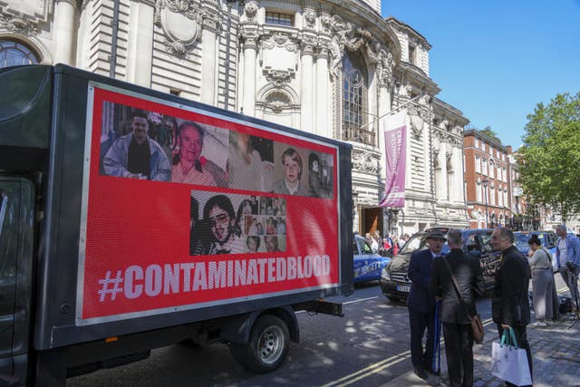 A van with a poster on outside Central Hall in Westminster, London, after the publication of the Infected Blood Inquiry report