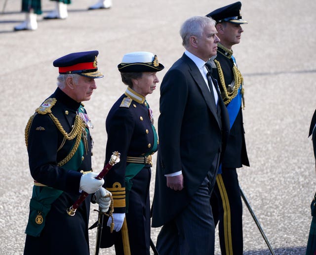 The King, the Princess Royal, the Duke of York and the Earl of Wessex walk behind the Queen's coffin during the procession from the Palace of Holyroodhouse to St Giles’ Cathedral