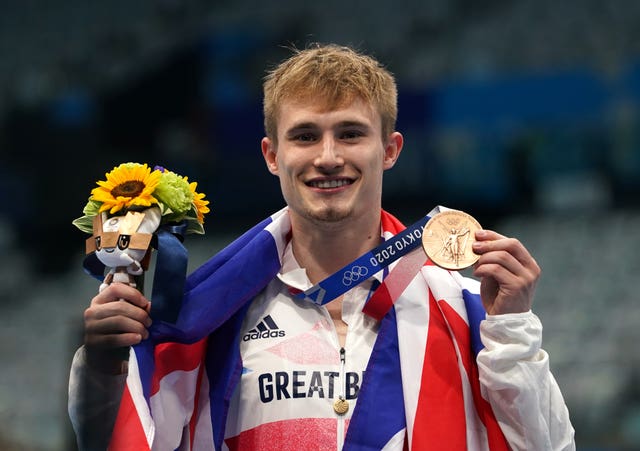 Jack Laugher poses with his gold medal