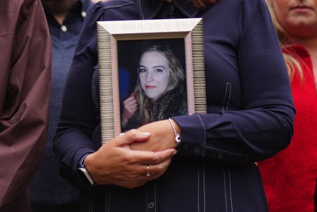 Bernie McNally, holding a framed photograph of her daughter Natalie McNally outside Belfast Crown Court,
