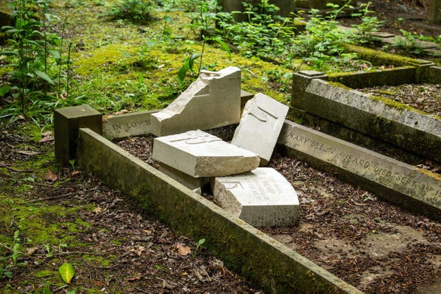 A gravestone found smashed in the cemetery