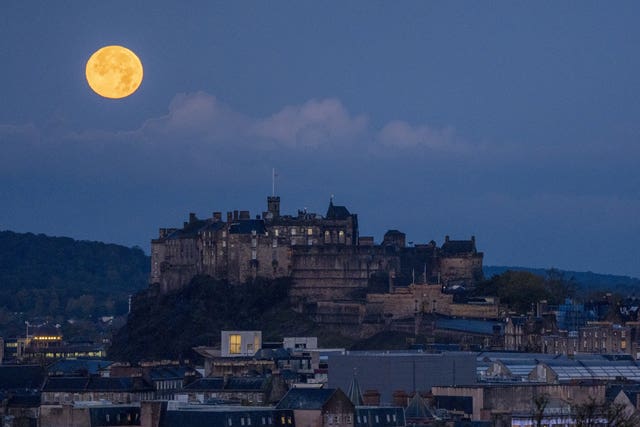 View of Edinburgh Castle under a full moon