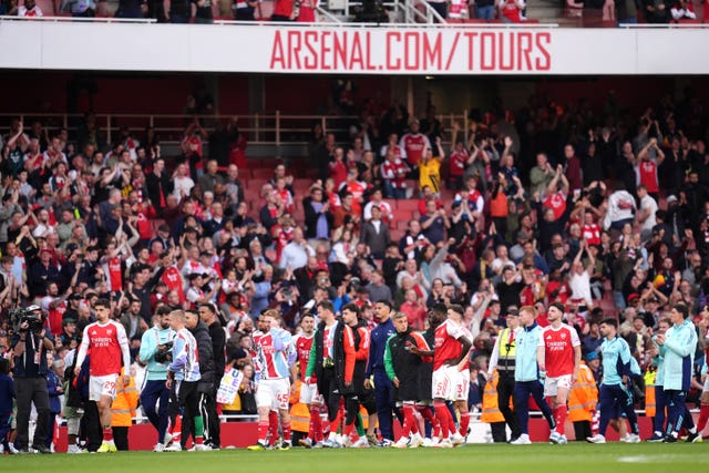 Arsenal players complete a lap of honour following their final home game of the season 
