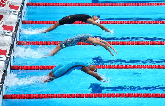 Zimbabwe’s Donata Katai, India’s Maana Patel and Grenada’s Kimberly Ince during the Women’s 100m Backstroke heats in Tokyo