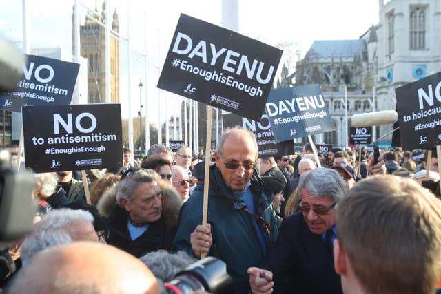 People protest against anti-Semitism in the Labour party in Parliament Square, London (Yui Mok/PA)