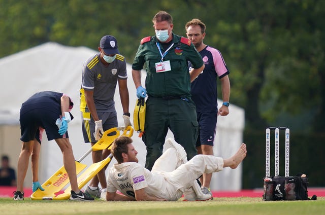 Liam Dawson had to be carried off on a stretcher with what looked a serious Achilles tendon injury.